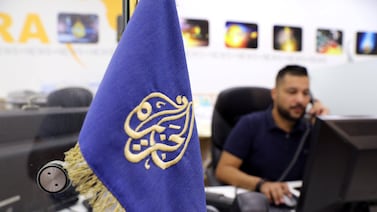 An employee works inside the office of the Qatar-based Al-Jazeera network in Jerusalem. Reuters