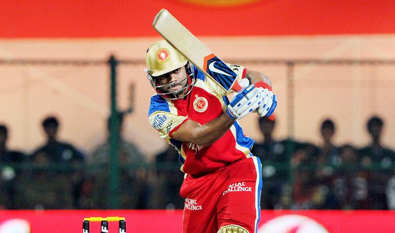 Royal Challengers Bangalore batsman Virat Kohli plays a shot during the IPL Twenty20 cricket match between Royal Challenger Bangalore and Kings XI Punjab at the M. Chinnaswamy Stadium in Bangalore on May 2, 2012. RESTRICTED TO EDITORIAL USE. MOBILE USE WITHIN NEWS PACKAGE. AFP PHOTO/Manjunath KIRAN