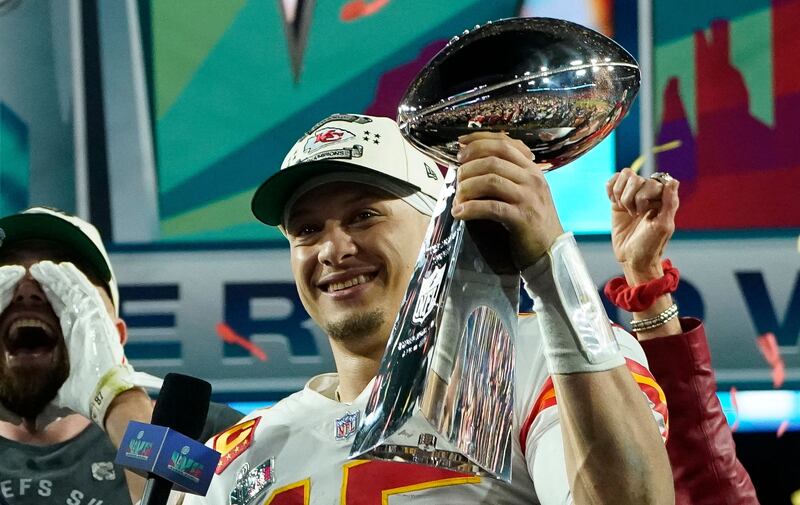 Kansas City Chiefs' quarterback Patrick Mahomes holds the trophy as he celebrates his team winning Super Bowl LVII. AFP