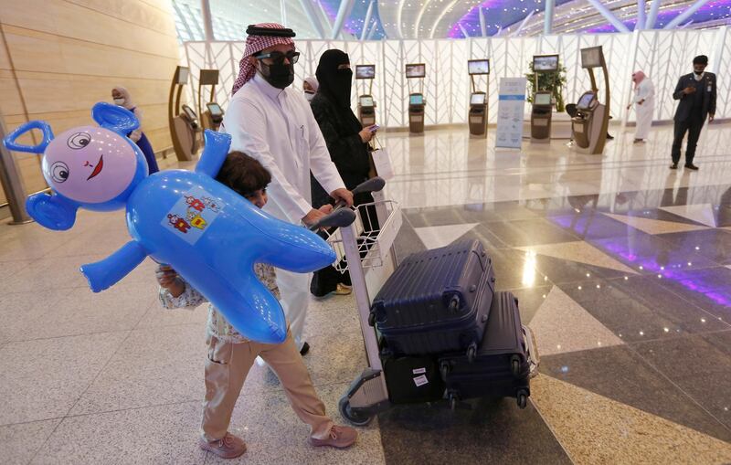 Saudis under 18 are allowed to travel, although travellers to Bahrain must be over 18, according to an update reported by the official Saudi Press Agency. AP Photo