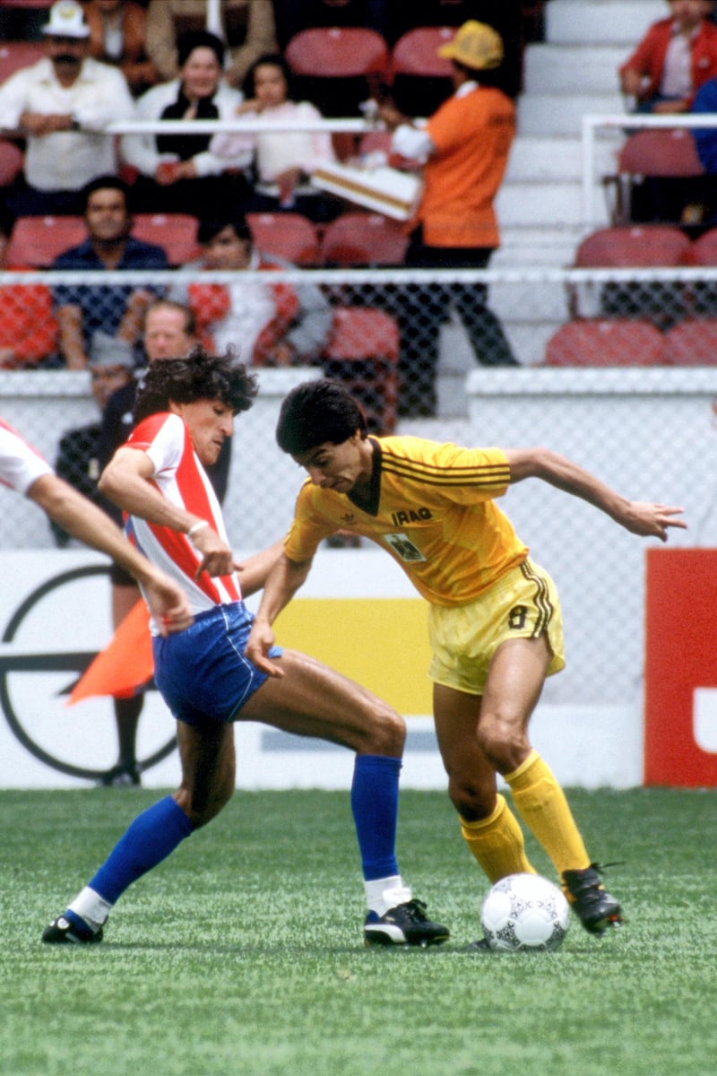 Iraq's Ahmed Radhi (r) takes on Paraguay's Cesar Zavala (l)  (Photo by Peter Robinson/EMPICS via Getty Images)