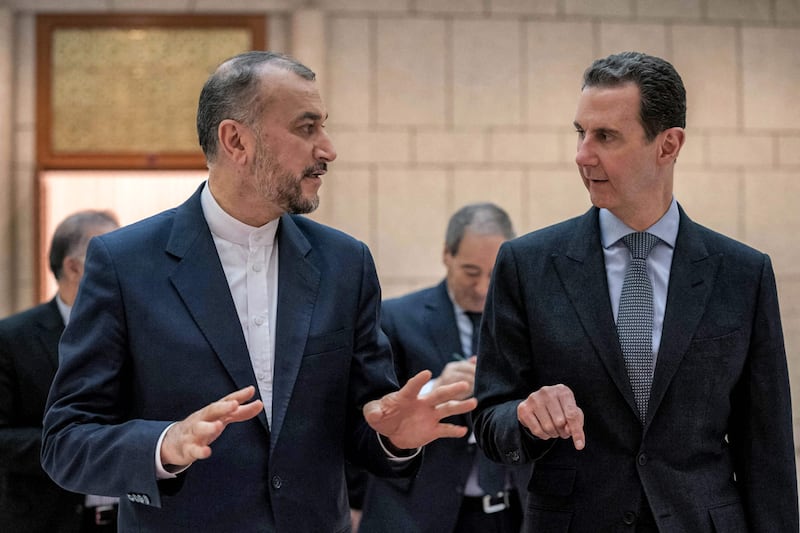 Syrian President Bashar Al Assad with Iran's Foreign Minister Hossein Amirabdollahian in Damascus. AFP