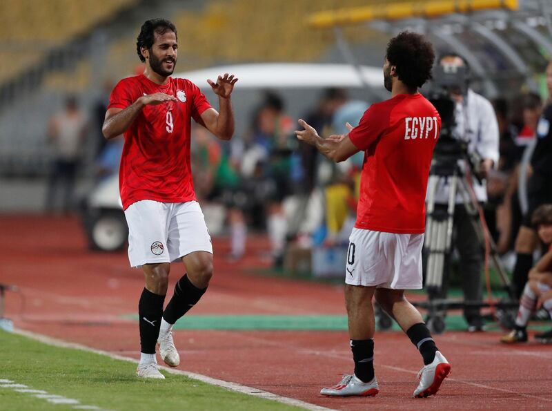Mohsen celebrates scoring their first goal with Mohamed Salah. Reuters