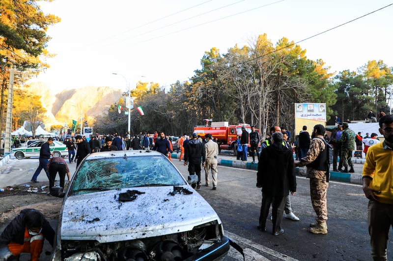 People gather after the explosion in Kerman after an event to mark the fourth anniversary of the Islamic Revolutionary Guard Corps’ Quds Force commander's death. AP