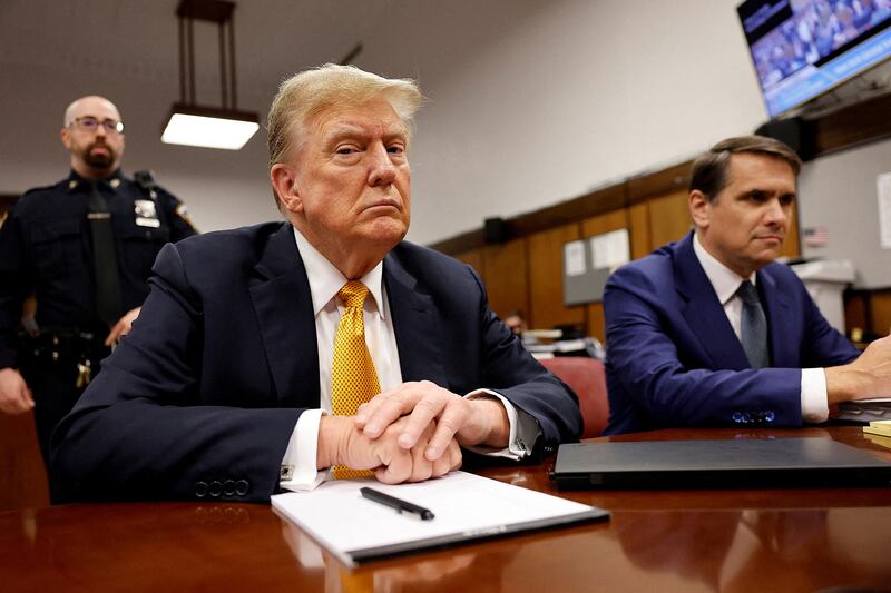 Former US president Donald Trump sits in a New York courtroom during his criminal trial. Reuters
