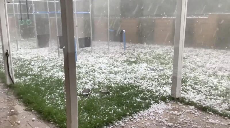 Hail stones hit the yard of a house in Warrandyte, Victoria, Australia. Reuters