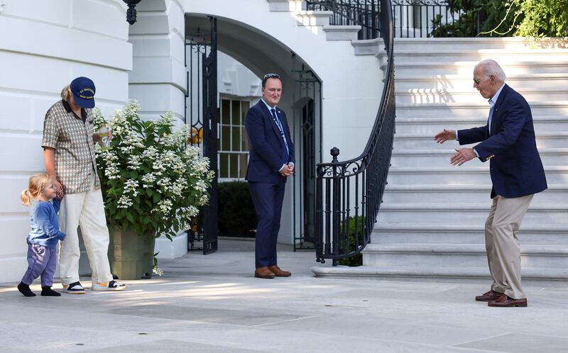 Maisy Biden brings her brother Beau Biden out of the White House in Washington to greet their grandfather, US President Joe Biden, on his return from a trip to Europe. Reuters