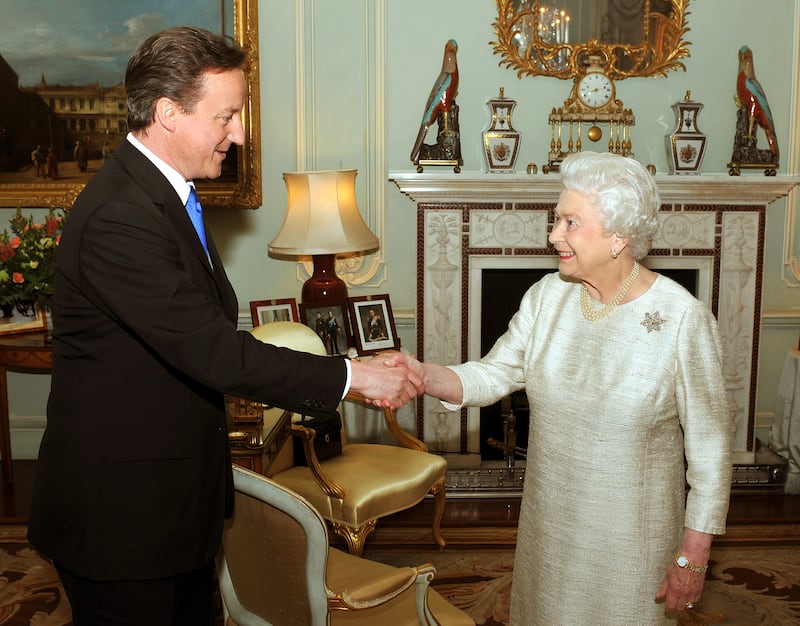 Queen Elizabeth greets David Cameron at Buckingham Palace for an audience to invite him to be the next Prime Minister, in May 2010.  Getty Images