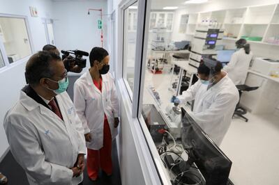 Tedros Adhanom Ghebreyesus and Belgium's Minister of Development Cooperation Meryame Kitir visit a WHO-backed mRNA vaccine hub in Cape Town, South Africa.