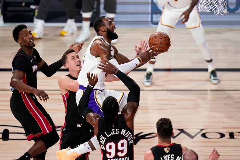 Los Angeles Lakers' LeBron James goes up for a basket against Miaimi. AP