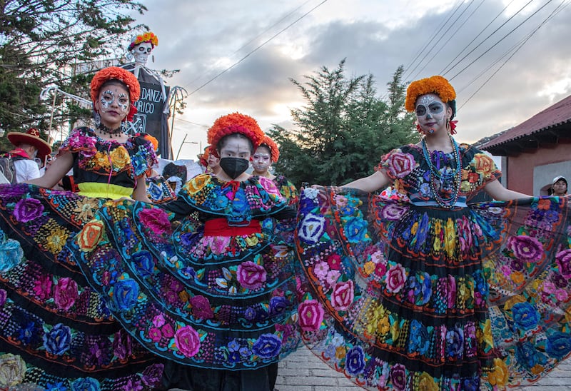A group of indigenous women dressed as Catrinas parade in the city of San Cristobal de las Casas in Mexico.  Hundreds of people dressed as skulls, ghosts and monsters paraded through the main streets of San Cristobal de Las Casas, to celebrate the mix of the traditional Day of the Dead of Mexico with Halloween of the United States. EPA