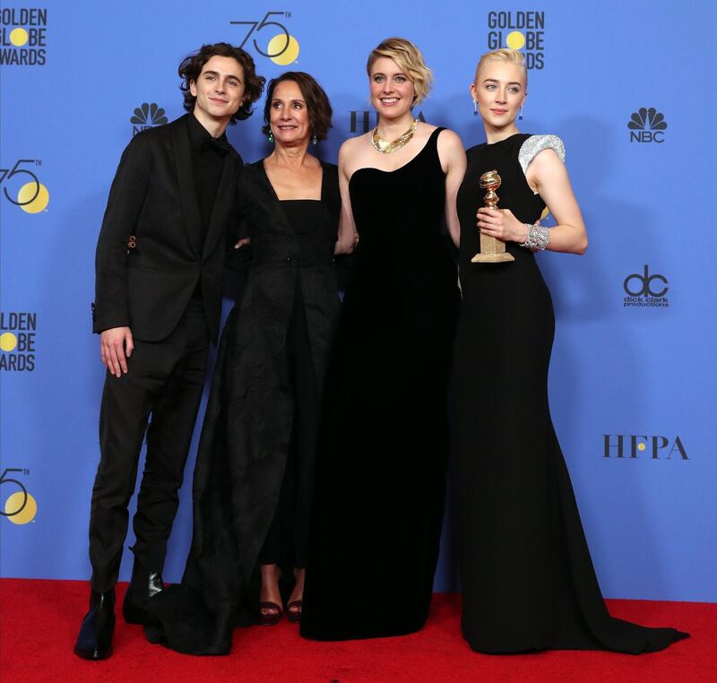 epa06424475 Saoirse Ronan (R) holds the award for Best Performance by an Actress in a Motion Picture Musical or Comedy in 'Lady Bird' with Timothy Chalamet (L), Laurie Metcalf (2-L), and Greta Gerwig (2-R) in the press room during the 75th annual Golden Globe Awards ceremony at the Beverly Hilton Hotel in Beverly Hills, California, USA, 07 January 2018.  EPA/MIKE NELSON *** Local Caption *** 52514391