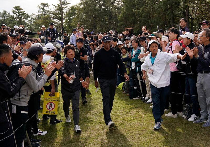 Tiger Woods walks to the 8th hole. AP