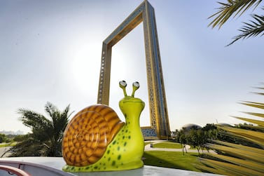 Dubai, United Arab Emirates - April 18, 2019: Photo project. Freddie the snail located at the Dubai frame. The Propshop has the largest inventory of quality event props in the UAE, individually hand cast and hand painted. 2019. Dubai. Chris Whiteoak / The National