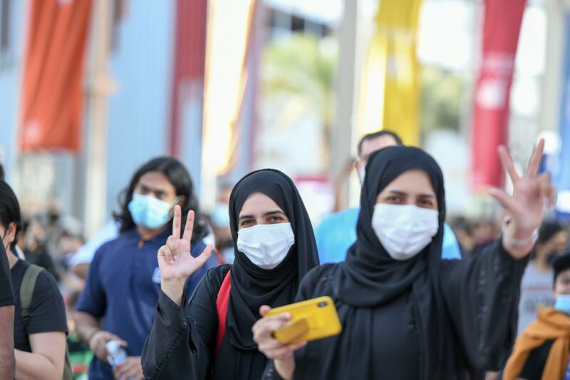 Visitors stop to take pictures of Expo sights during the event. Khushnum Bhandari / The National