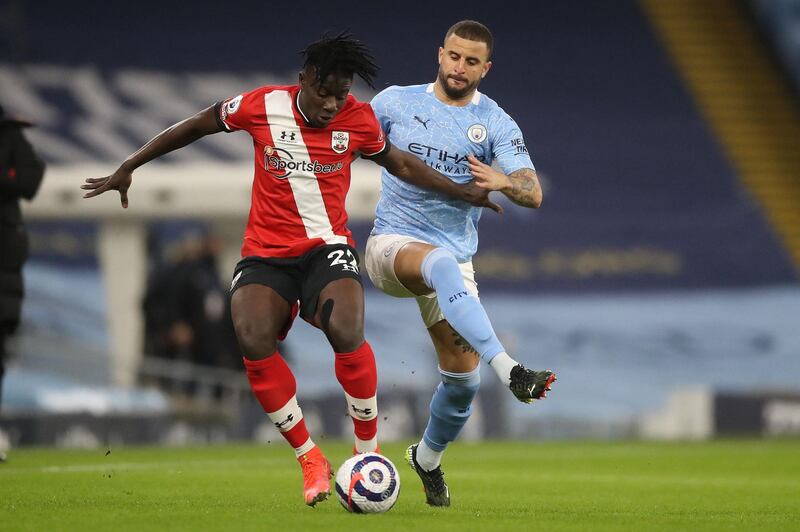 Southampton defender Mohammed Salisu under pressure from Manchester City's Kyle Walker during the Premier League match at the Etihad Stadium on March 10. AFP