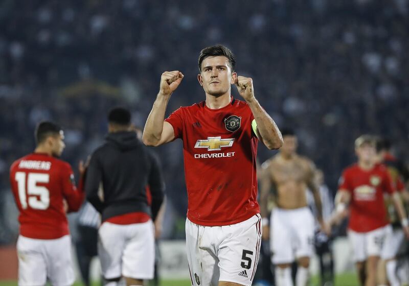 Harry Maguire celebrates with fans after United's 1-0 win at the Partizan Stadium. Getty Images