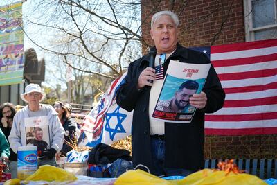 Samuel DeMarco III speaks at a vigil in Squirrel Hill in support of hostages held by Hamas