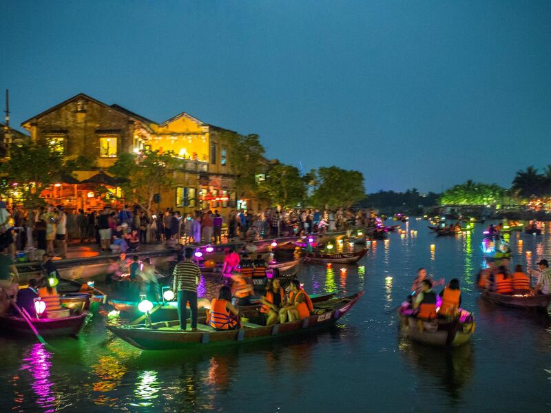 HOI AN, QUANG NAM PROVINCE, VIETNAM - 2018/03/30: Tourists on the Thu Bon River in Hoi An's old quarter during the Lantern Festival. A trading port from the 15th to the 19th century, then known as Faifoo, the well preserved old town has World Heritage status. The Lantern Festival occurs each full moon. (Photo by Leisa Tyler/LightRocket via Getty Images)