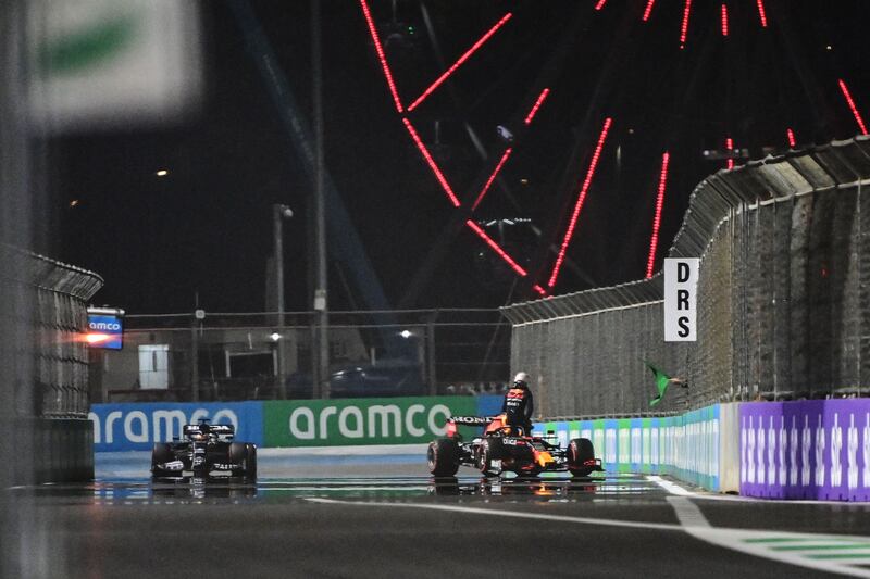 Mercedes driver Lewis Hamilton drives past Max Verstappen  after the Red Bull Dutch driver hit the wall in qualifying. AFP