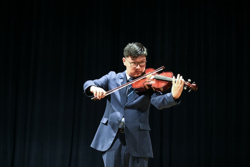 Diwen Xu, 18, plays the viola at Brighton College Abu Dhabi. All pictures by Khushnum Bhandari / The National