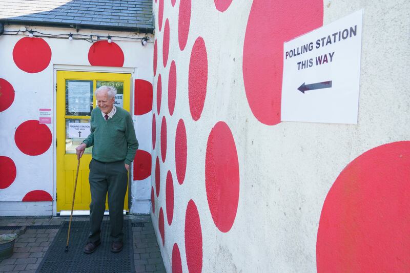A man leaves a polling station at a cafe in Stockbridge. EPA