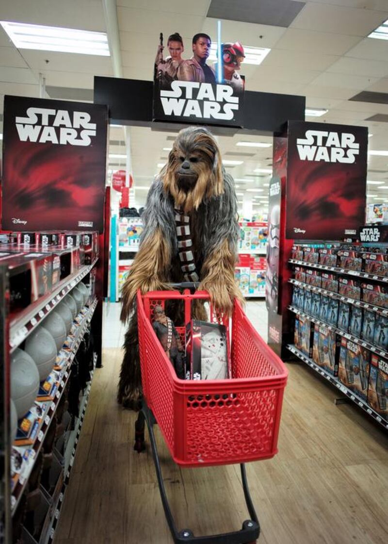 A fan dressed as Chewbacca shops for merchandise. Jason Reed / Reuters