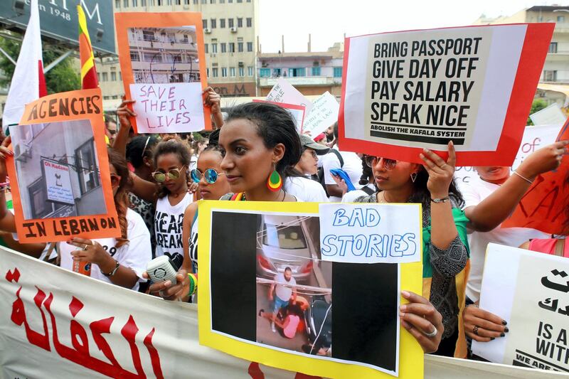 Migrant domestic workers from various nationalities demonstrate in the northern suburbs of Beirut to protest against abuses and ask for law protection, on June 24, 2018. / AFP PHOTO / ANWAR AMRO