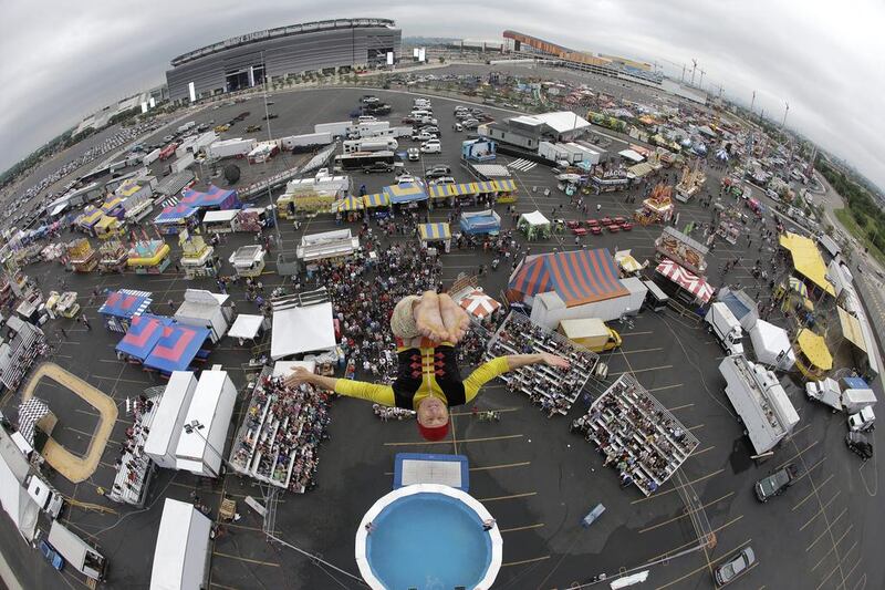 Dan Poor, of Jacksonville, Florida, dives from an 85-foot tall platform into a 9.5-foot pool during a performance by the Sinbad High Dive Show at the State Fair Meadowlands carnival, in East Rutherford, New Jersey. Julio Cortez / AP