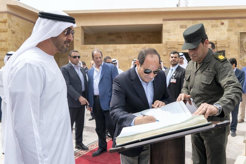 AL ALAMEIN, EGYPT - March 28, 2019: HE Abdel Fattah El Sisi President of Egyp (C) signs the guests book during a tour at Al Alamein Military Museum. Seen with HH Sheikh Mohamed bin Zayed Al Nahyan, Crown Prince of Abu Dhabi and Deputy Supreme Commander of the UAE Armed Forces (L).

( Rashed Al Mansoori / Ministry of Presidential Affairs )
---