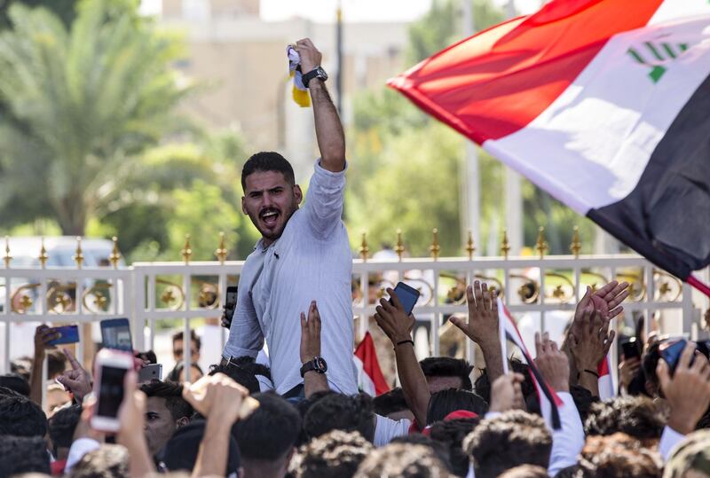 Students take part in an anti-government demonstration in front of their university in Basra. AFP