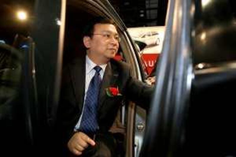 Wang Chuanfu, chairman and president of BYD Co., sits for photos in a BYD vehicle at the 2009 North American International Auto Show (NAIAS) in Detroit, Michigan, U.S., on Monday, Jan. 12, 2009. BYD Co., the Chinese automaker backed by billionaire investor Warren Buffett, plans to bring electric autos to the U.S. in 2011. Photographer: Fabrizio Costantini/Bloomberg News