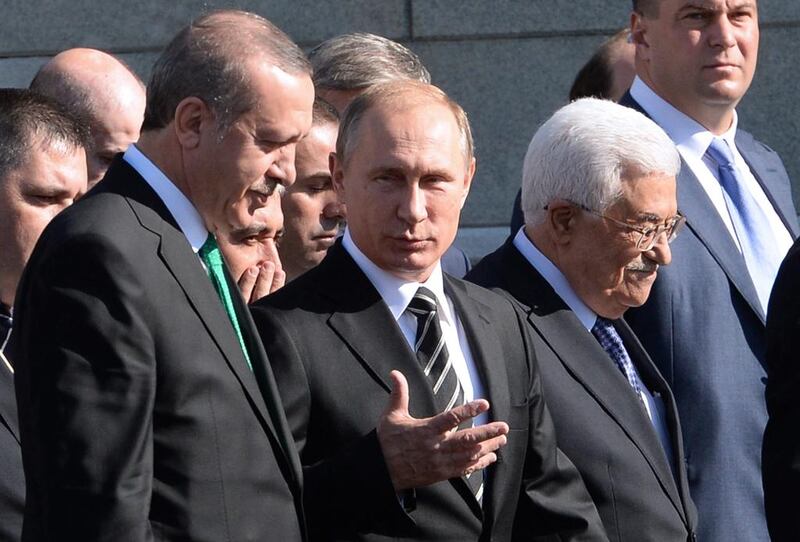 Turkish president Recep Tayyip Erdogan, Russian president Vladimir Putin and Palestinian leader Mahmud Abbas arrive for the opening ceremony of the Moscow Grand Mosque in Moscow. Vasily Maximov / AFP Photo 

