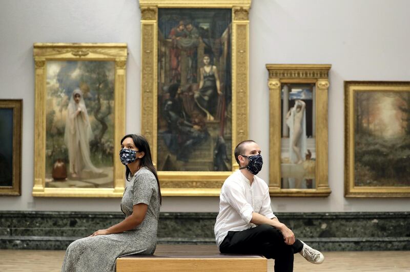 LONDON, ENGLAND - JULY 24: A general view of visitors wearing face masks at the Tate Britain on July 24, 2020 in London, England. As the country further emerges from the COVID-19 lockdown, galleries and museums such as this are once more opening their doors to the public, albeit with certain guidelines and conditions in place, to protect the health of visitors. (Photo by John Phillips/Getty Images)