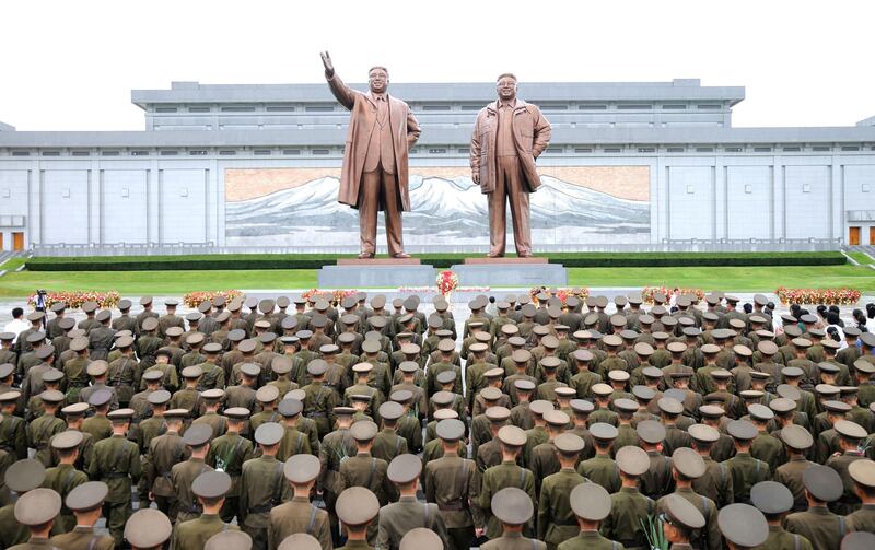 Servicemen of the Korean People's Army visit the statues of North Korea's founding president Kim Il-sung and leader Kim Jong-il on the occasion of the 72nd anniversary of Korea's liberation. KCNA via Reuters