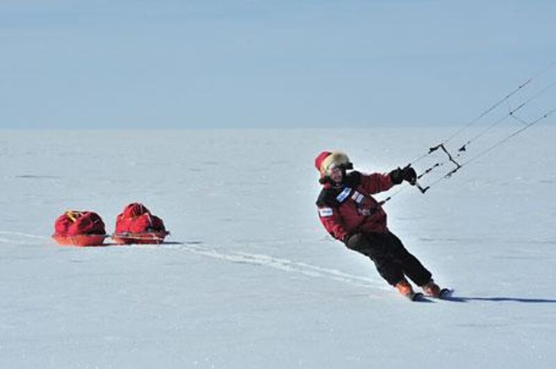 Adrian Hayes kite-skis across Greenland on Wednesday, towing two sleds of supplies.