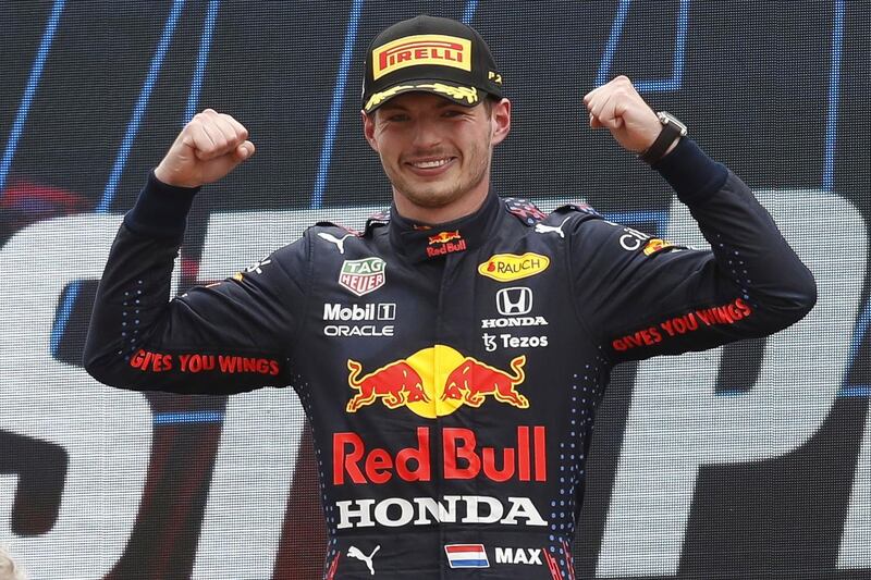 Dutch driver Max Verstappen celebrates on the podium. EPA