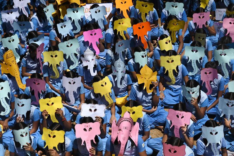 Indian children wearing masks of the elephant-headed Hindu deity Ganesha take part in an awareness campaign against the use of plastic, before the 'Ganesh Chaturthi' festival, at a school in Chennai. AFP