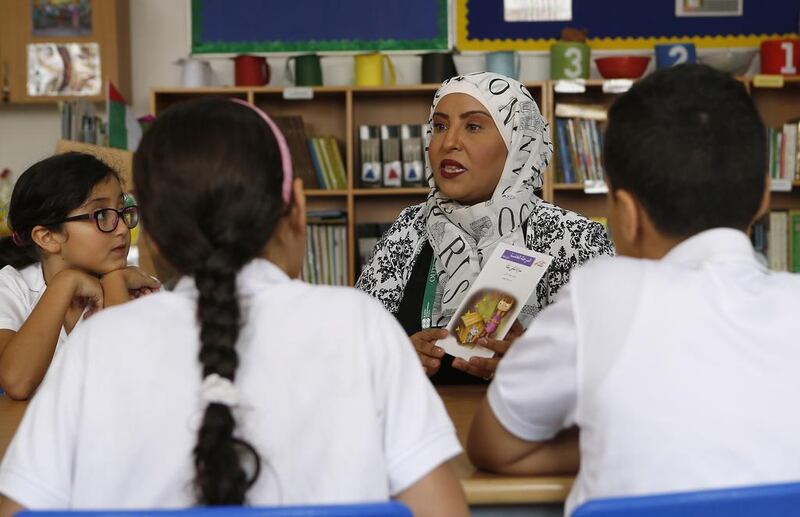 Nemah Ahmed, Arabic language coordinator at Raha International School, gets her pupils’ attention. Ravindranath K / The National