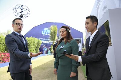 Dubai, March 18, 2018: (C) Mina Al Oraib, Editor in Chief of The National trys the drones with mind control also seen (L) Olivier Oullier, President,Emotiv and (R) Maverick Nguyen of Emotiv Inc at the GESF Education Forum in Dubai. Satish Kumar for the National/ Story by James Langton