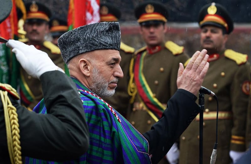 Afghan president Hamid Karzai inspects a honor guard before delivering his final address in parliament in Kabul on March 15. Wakil Kohsar / AFP PHOTO