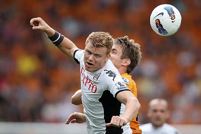 John Arne Riise, left, competes for the ball with Wolverhampton Wanderersâ€™ Kevin Doyle during Wolves's 2-0 win against the London club at Molineux.

Simon Dawson / AP Photo