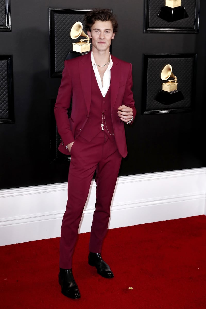 Shawn Mendes  wears a maroon suit by Louis Vuitton for the 62nd Annual Grammy Awards. EPA