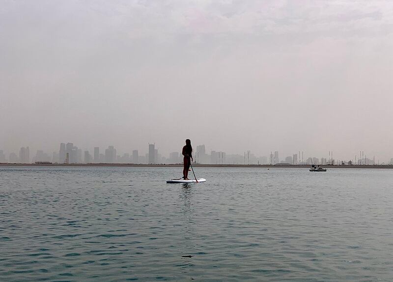 DUBAI, UAE, March 13 - People doing kayak in Deira Island during the cloudy and stormy weather in Dubai.  ( Pawan Singh / The National )