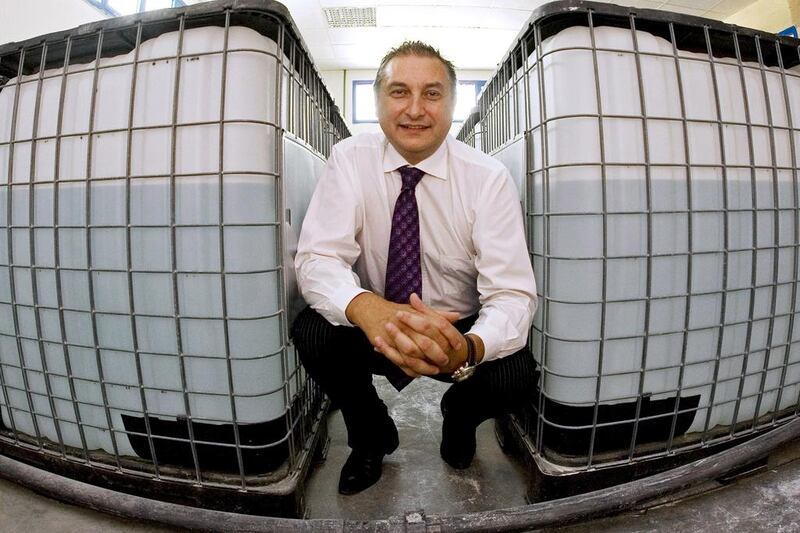 Peter Manzii, the manager of ClearWater in the company’s water purification plant where the equipment can filter up to 75,000 litres of water per day and is stored in these containers. Jeff Topping / The National