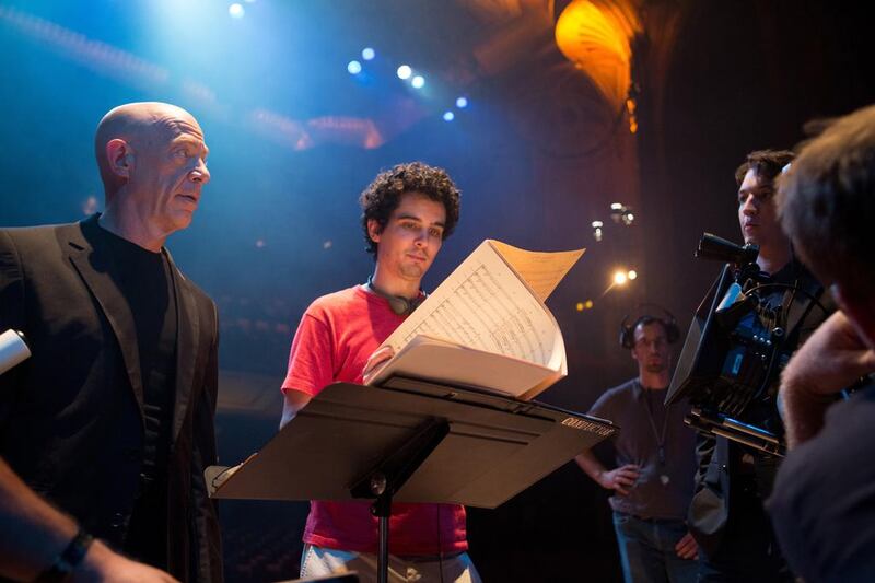 From left, the actor J K Simmons who plays the music teacher Terence Fletcher, the director Damien Chazelle and the actor Miles Teller, right, who plays the ambitious drumming student Andrew Neiman in Whiplash. Daniel McFadden