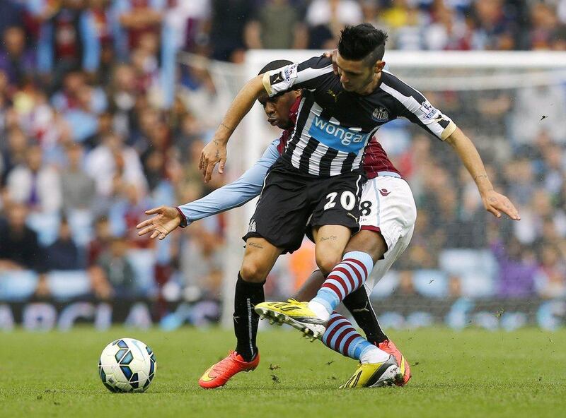 Aston Villa's Charles N'Zogbia, behind, challenges Newcastle United's Remy Cabella, front, during their 0-0 draw in the English Premier League on Saturday. Darren Staples / Reuters / August 23, 2014  