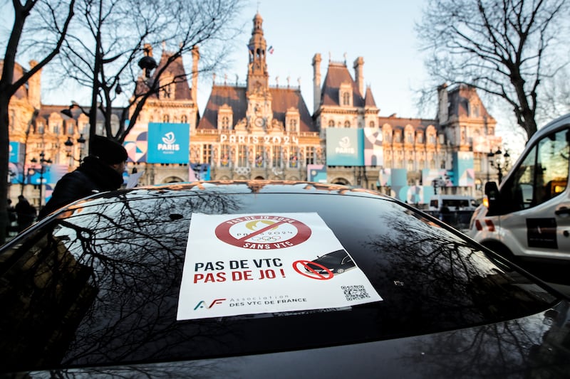 Cab drivers park in front of Paris City Hall to protest against Olympics traffic lane restrictions. EPA