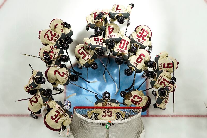 Montreal players huddle before a PWHL hockey game against Minnesota. AP