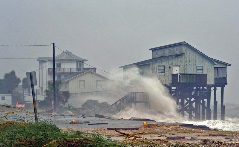 Waves crash against stilt houses along the shore at Alligator Point in Franklin County, Florida. Reuters